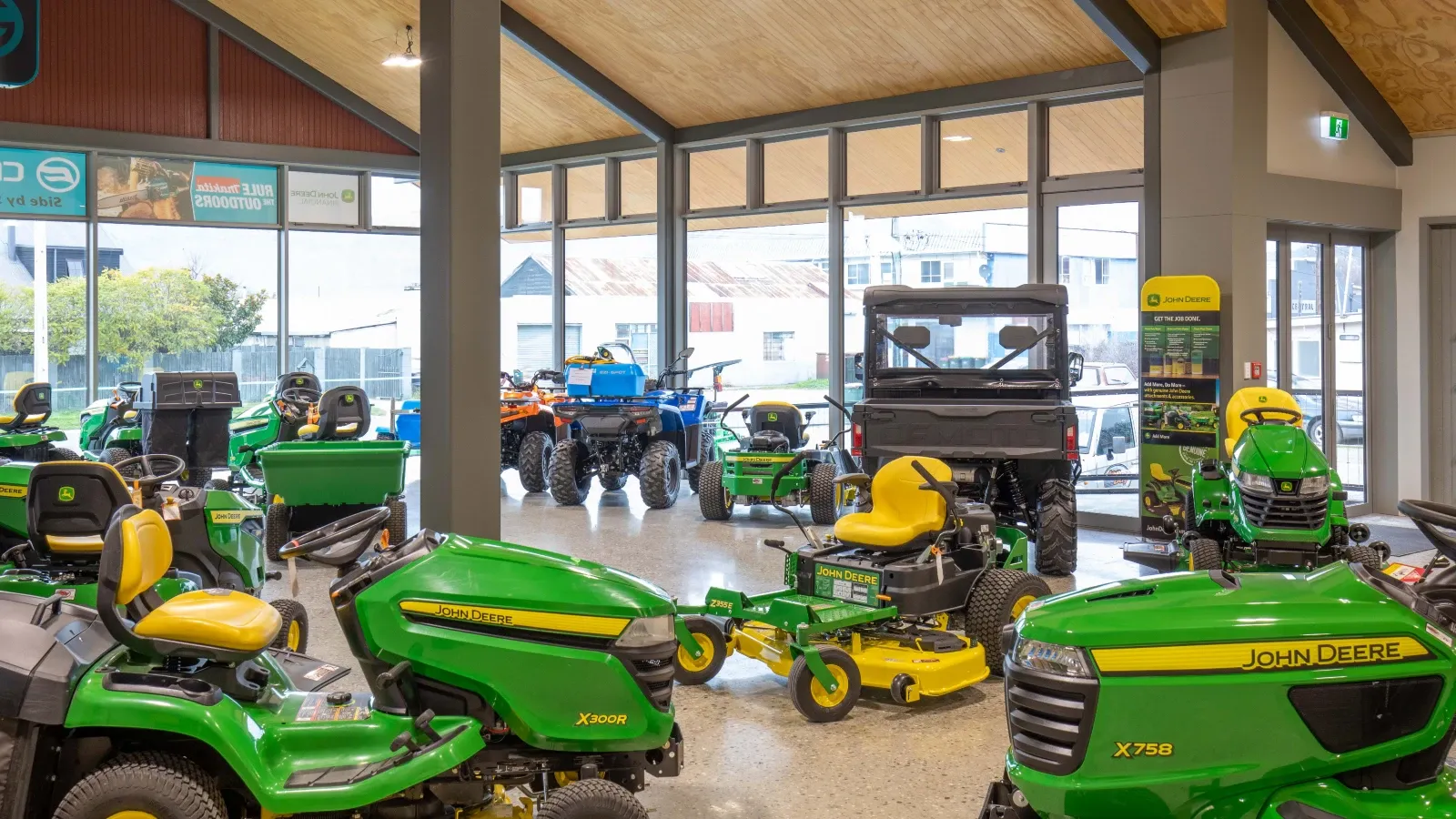John Deere tractors and ride-on mowers on display in the Ian Day showroom