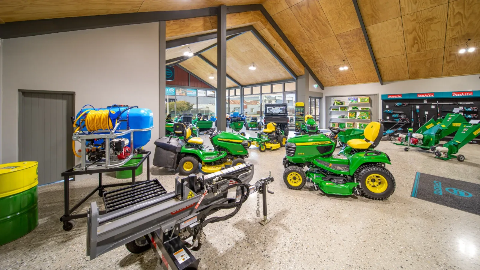 Outdoor power equipment displayed inside the Ian Day Farm & Lifestyle Equipment showroom